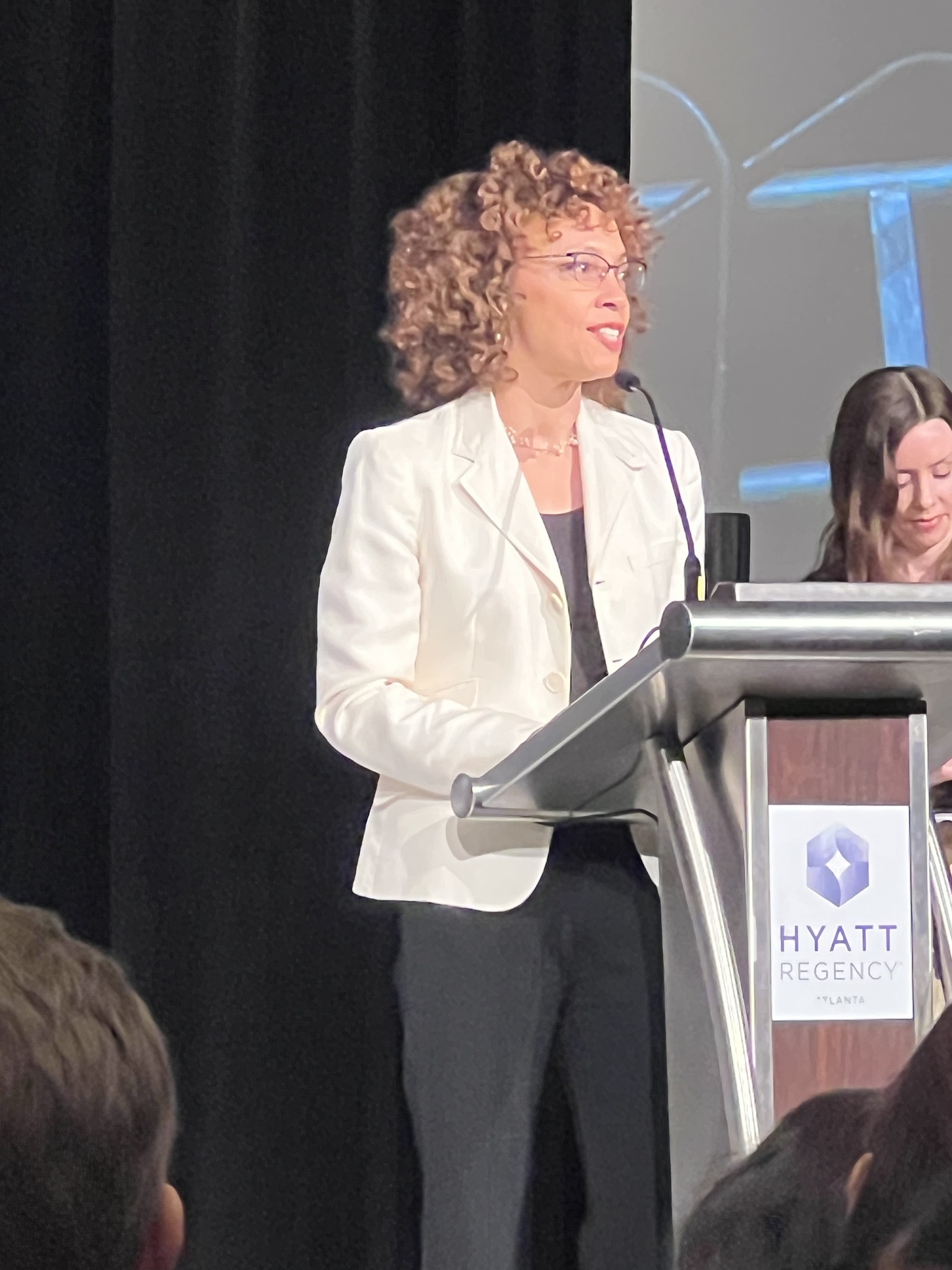 Judy Tyrus at the podium after receiving the Ernie Award from Dance/USA